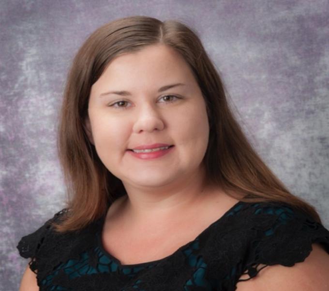 Lauren M. Bylsma headshot in front of Grey Background